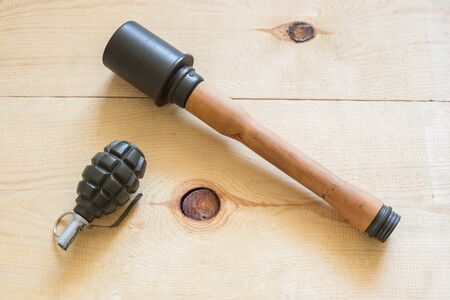 Two kind of grenades on wooden boardの写真素材