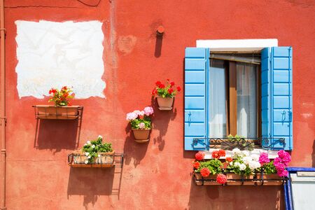 Small, cozy courtyard with colorful cottage / Burano, Veniceの写真素材