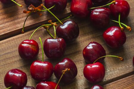 Cherries on the wooden tableの写真素材