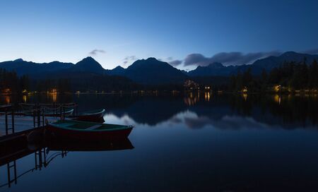 Night view of the lake and high mountainsの写真素材