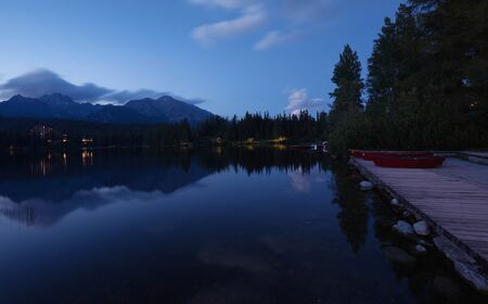 Night view of the lake and high mountainsの写真素材