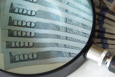 USA dollars, high nominals under the magnifying glassの写真素材