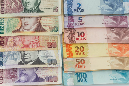 Brazilian money and Argentinian peso  / business conceptの写真素材