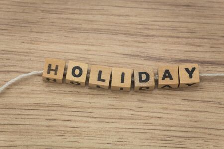 inscription / holiday / arranged from blocks strung on a stringの写真素材