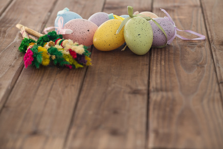 Easter eggs and decoration on wooden backgroundの写真素材
