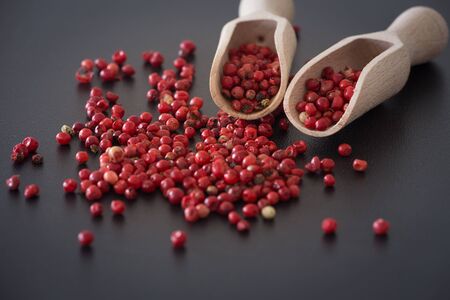 Brazilian pepper on the dark stoneの写真素材