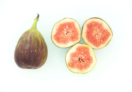 Delicious ripe figs on the isolated white backgroundの写真素材