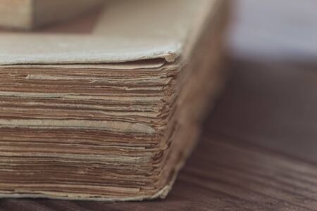 Old book on the wooden tableの写真素材