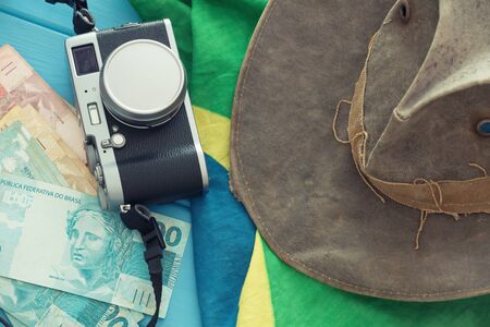 Brazil flag, money, hat and camera. The concept of a holiday tripの写真素材