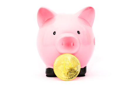 piggy bank and Bitcoin. concept of saving and investing in virtual currencyの写真素材