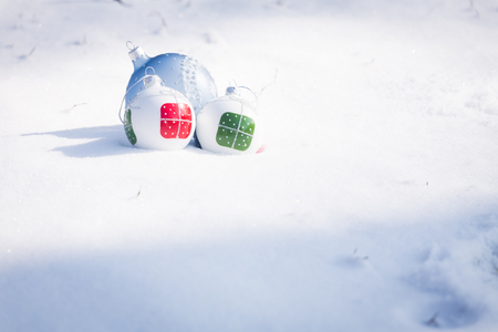 Christmas decorations on white snowの写真素材
