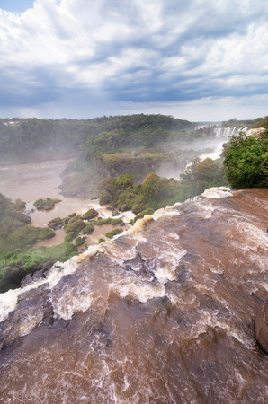 Breathtaking view of the Iguazu waterfalls roaringの写真素材