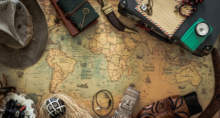 Old map, vintage travel equipment and souvenirs from around the worldの写真素材