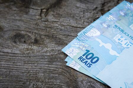 Brazilian money on an old board with space for an inscriptionの写真素材