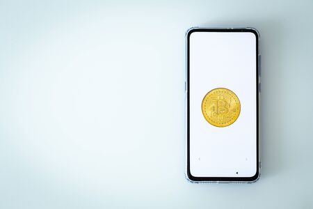 smartphone with Bitcoin on the screen and with space for textの写真素材