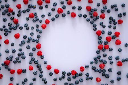Seasonal fruits, blueberry and raspberry, Empty place for an inscriptionの写真素材