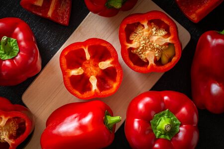 Red pepper Healthy vegetables, whole and cut. Dark Backgroundの写真素材