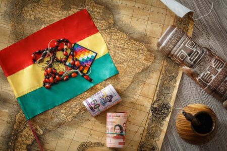 Bolivia. Country flag on the background of the old map and things associated with Bolivia