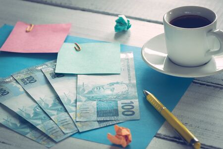 Brazilian money, reais banknotes with blank note cardsの写真素材