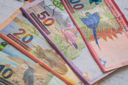 Bolivian money. Various banknotes spread out on a tableの写真素材