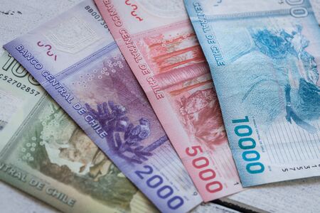 Money from Chile, pesos, Various banknotes spread out on the table