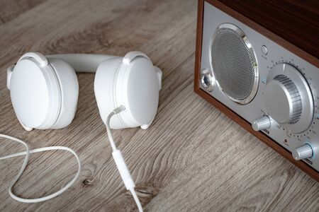 radio with white headphones. Creative listening concept