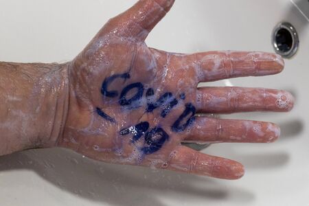 Hand washing, Basic protection against coronvirus infection, Soapy hands with the inscription...