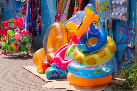 Toys and water equipment for children, Sold on the beach of the Baltic Sea. Mi?dzyzdroje, Poland. 24...