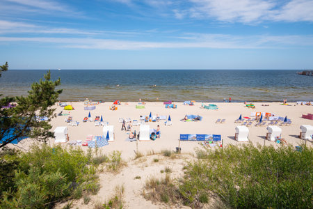 Beach on the Baltic Sea, Beginning of summer season during the coronavirus pandemic, Screens diving sunbathers. Miedzyzdroje, Poland, 24 june 2020のeditorial素材