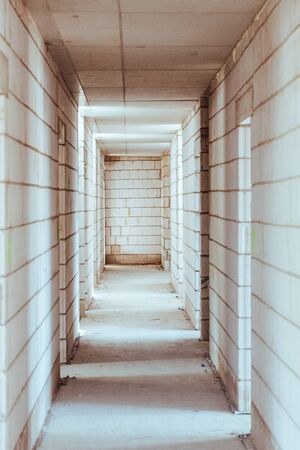 Construction, not completed corridor and exits to further roomsの写真素材