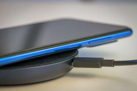 phone charging on the charger charging, Close up