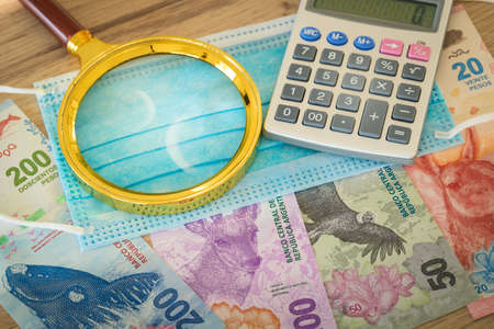 Argentinian currency, paper notes, new animal designs, magnifier, calculator and anti-virus mask....