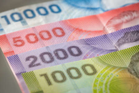 Chile money, Pesos, Paper notes of various values lying on the deskの写真素材