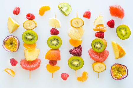 Full of vitamins, juicy fruit skewers The concept of healthy eating and diet, White backgroundの写真素材