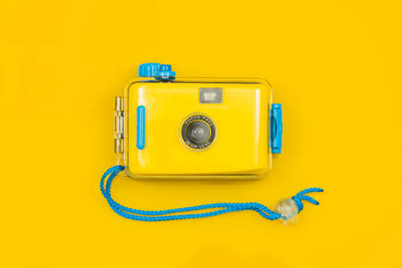 Stylish Yellow-blue camera for underwater photos on a yellow background.の写真素材