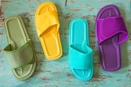 Variously colored flip-flops for walking on the house or the beach. Stylish Design of different...
