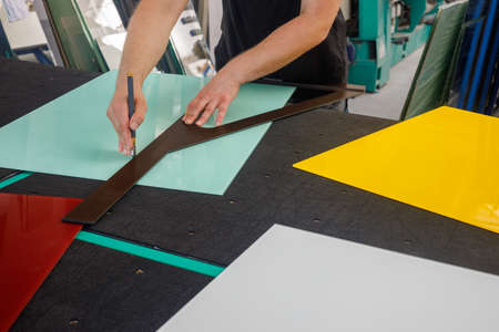 cutting colored glass in the glass workshop