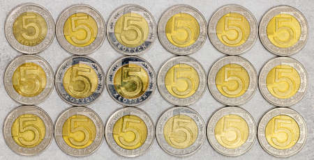 Five-zloty coins from Poland, evenly arranged, in rows, background,の写真素材