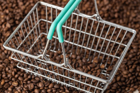 Lots of whole coffee beans and empty shopping cart. Concept of rising coffee pricesの写真素材