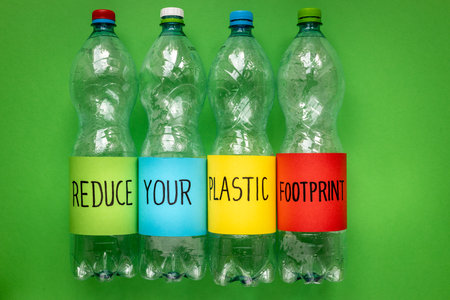 Reduce Your plastic footprint, Handwritten plastic bottles, Environmental concept, reduce the plastic around us, Caring for the earth and future generationsの写真素材