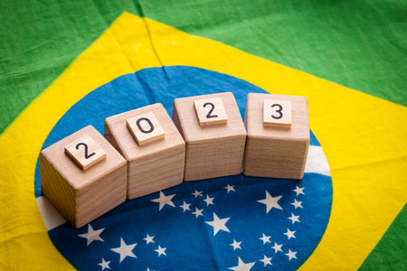 Brazil's economic prospects in 2023, Concept, Brazilian flag with wooden blocks with the symbol of...