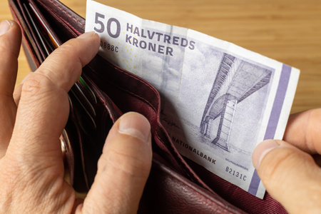 Denmark Money, 50 danish kroner banknote taken out of wallet, Financial and business concept, close...