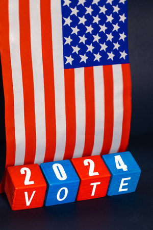 USA election 2024, US presidential election voting, concept, wooden blocks in US national colors,...