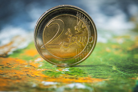 2 euro coin on Europe background, Financial and business concept, close up