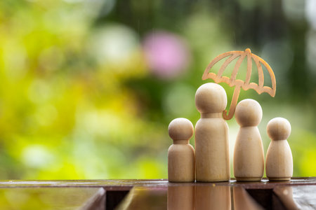 Umbrella icon and people model, rainy day, family home concept, family security, health care day, car insurance, safety protection and health insurance,の写真素材