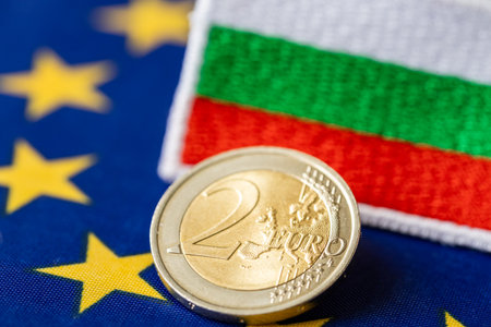 adoption of the Euro by Bulgaria, joining the euro zone, economic concept, euro coins, Bulgarian money, flag of Bulgaria and the European Unionの写真素材