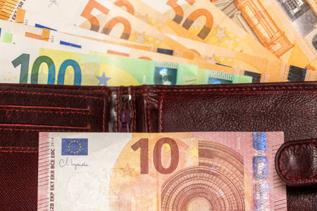 Euro sticking out of the wallet, Lots of banknotes, European currency, Financial concept, Business successの写真素材