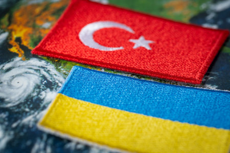 turkey and ukraine, country flags on the background of the globe, concept, mutual relations,...