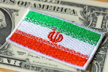 Iran flag on the background of the US dollar, financial conceptの写真素材
