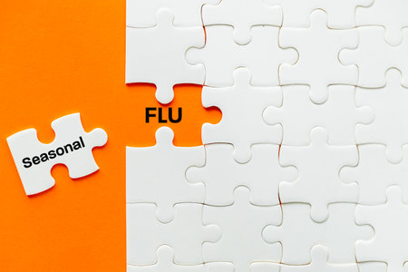 Seasonal Flu. A piece of a puzzle removed the slogan Seasonal Flu. Medical concept. Healthcare, Flu vaccination, orange background, Copy spaceの写真素材
